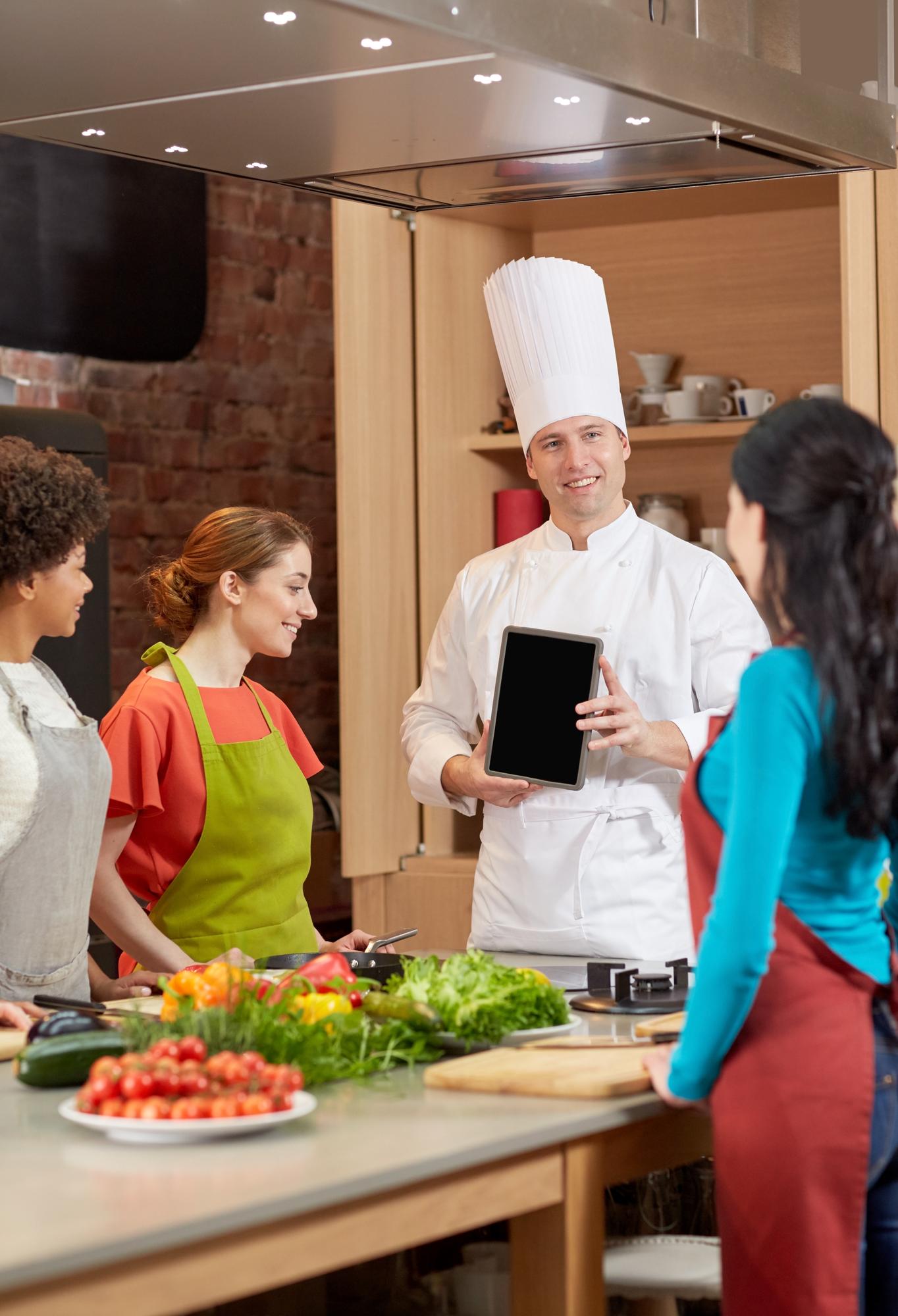 Assistant chef guiding a student